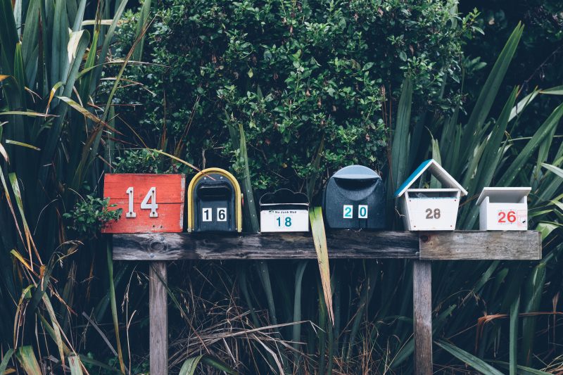 six unique mailboxes in a row